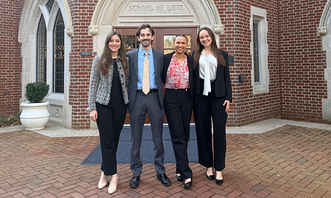 Olivia Buckner, Colin Pelletier, Grace Craft and Camille Weindorf standing in front of building